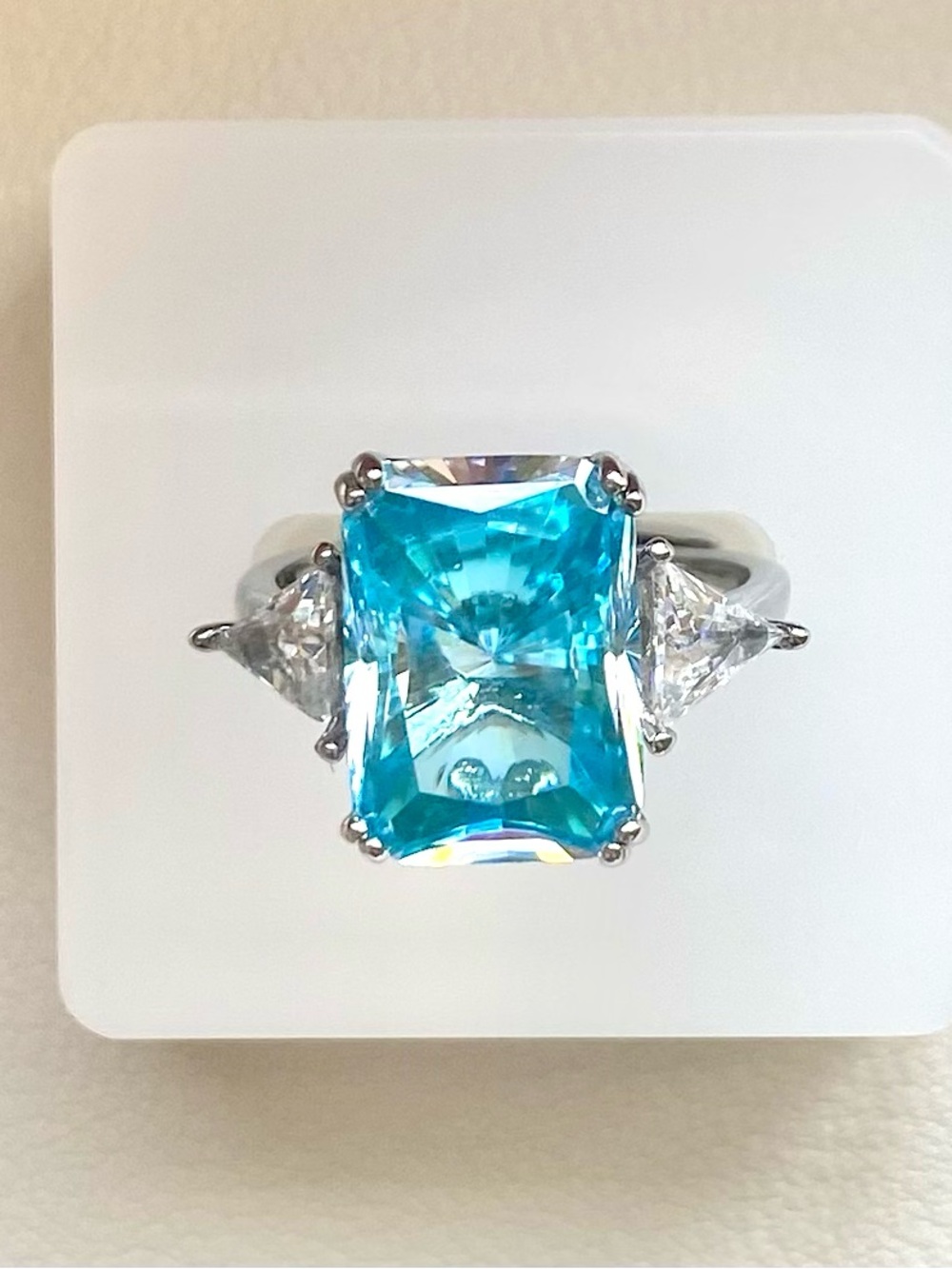 Blue Emerald-Cut Gemstone Ring with Side Stones